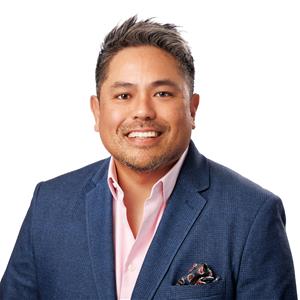 A headshot of Mike Akahoshi, Senior Vice President of Hospitality Service at LAZ Parking.